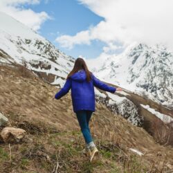young-woman-walking-mountains